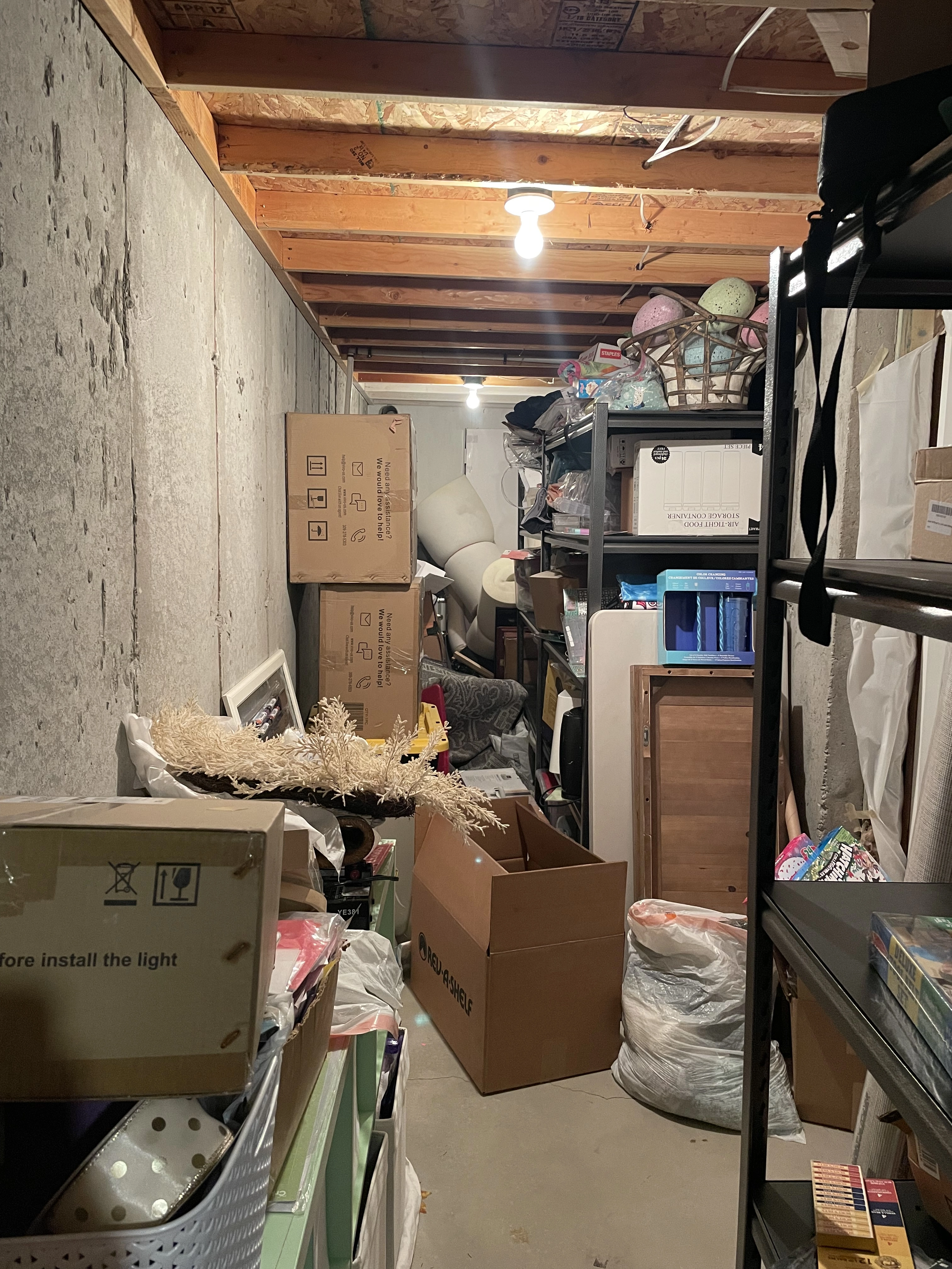 Cluttered disorganized storage space before ModJobs organizing in Utah